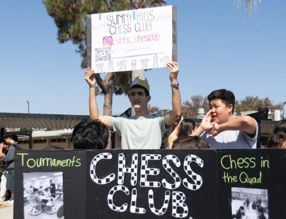 Two Chess Club members, seniors Anthony Mitri (left) and Jeremiah Sung, promote their group at break on the first day of Club Rush, Tuesday, Sept. 3.